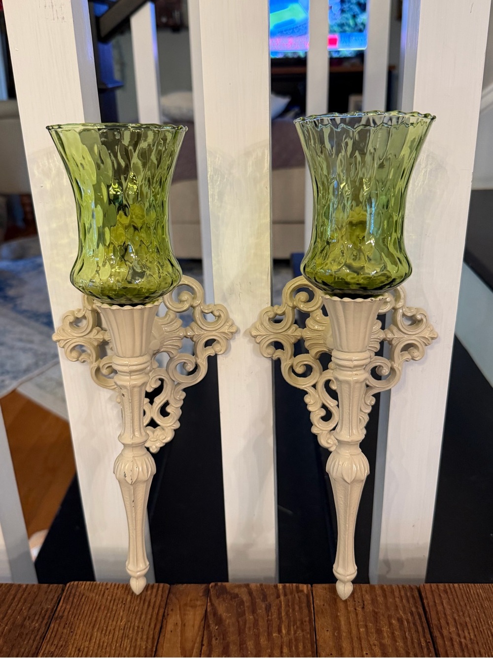 (2) vintage cast metal candle wall sconces paired with green glass votive cups